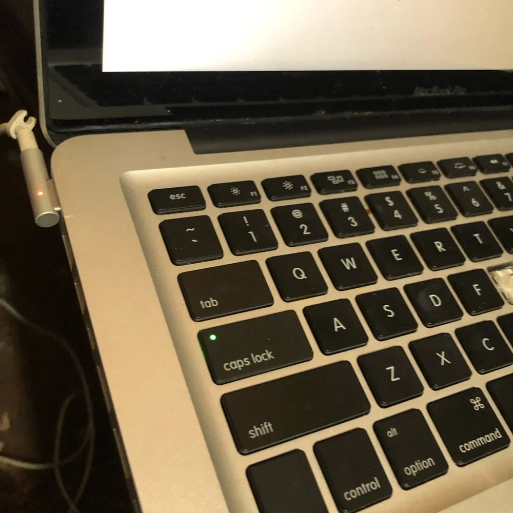 Apple MacBook with 4 chargers and dell laptop for parts